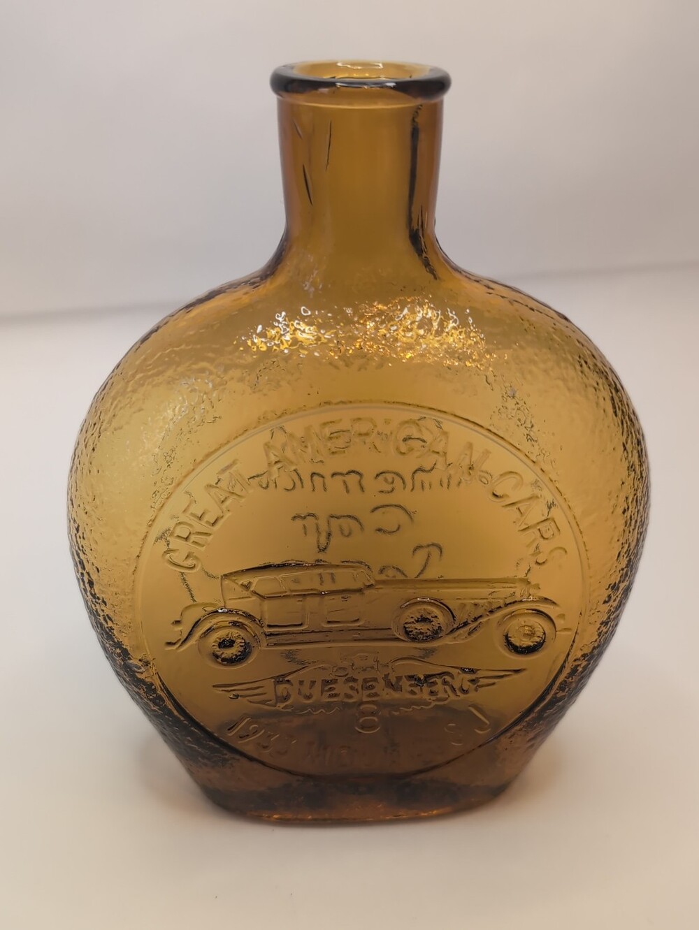 Vintage HCB Amber Glass Bottle Embossed With "Great American Car Series"